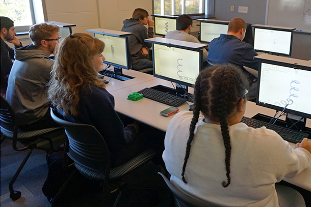 Students sitting at computers in a computer lab