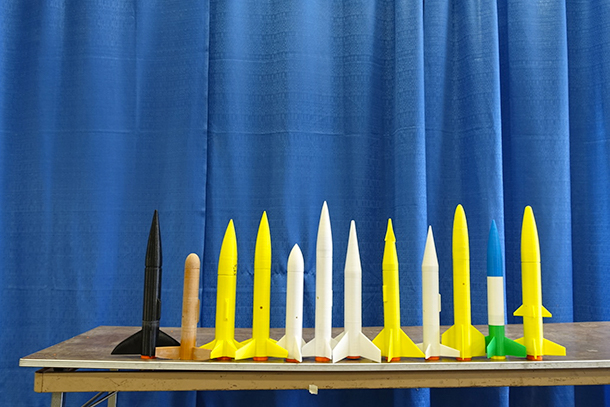 Three-dimensional printed rockets sitting on a table