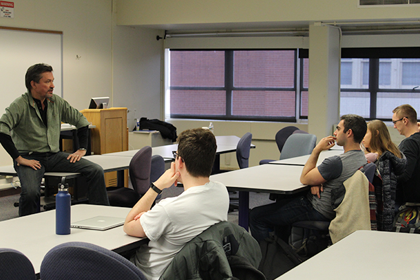 Tom Hartman talking with students in an engineering entrepreneurship class