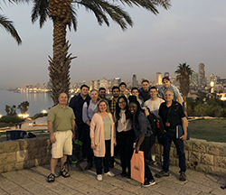 The class, faculty and guide Marc Coles gather after dinner in Jaffa, overlooking Tel Aviv 