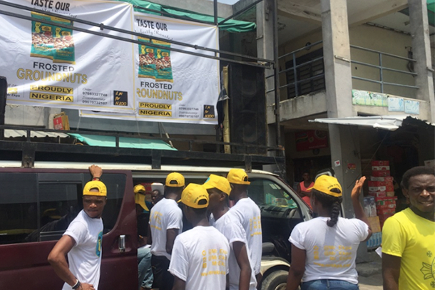 L&L Foods employees work to promote the company and its nut offerings in Nigeria.