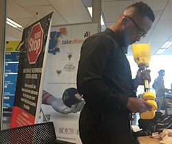 Robinson Laventure inspects TakeaHand's 3D-printed prosthetic leg