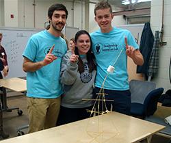 Leadership & Innovation Lab members pose with their uncooked spaghetti and marshmallow structure at the inaugural Design Olympics.