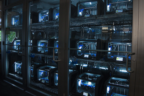 Glass door cabinet full of 3D printers