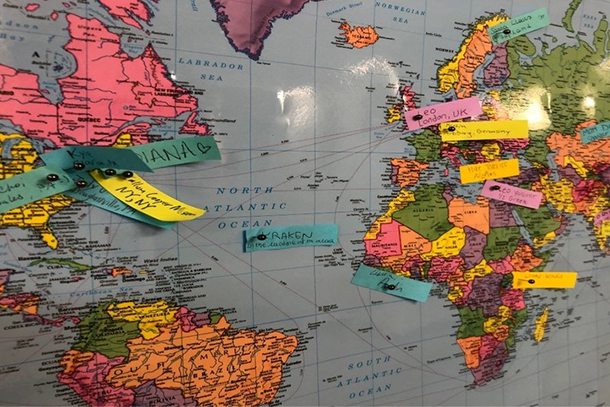 World map that has sticky notes in various locations